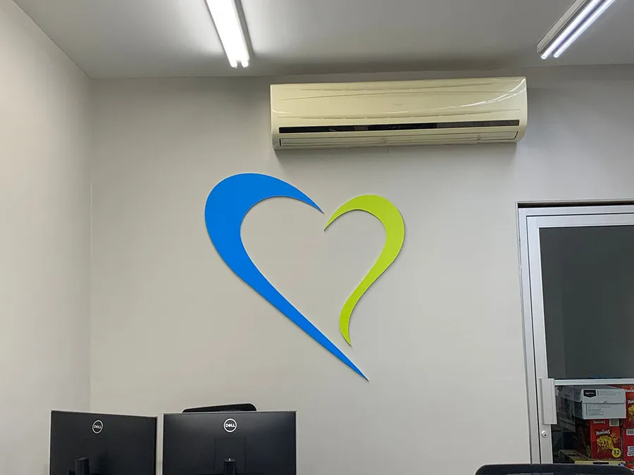Interior signage heart-shaped logo installation